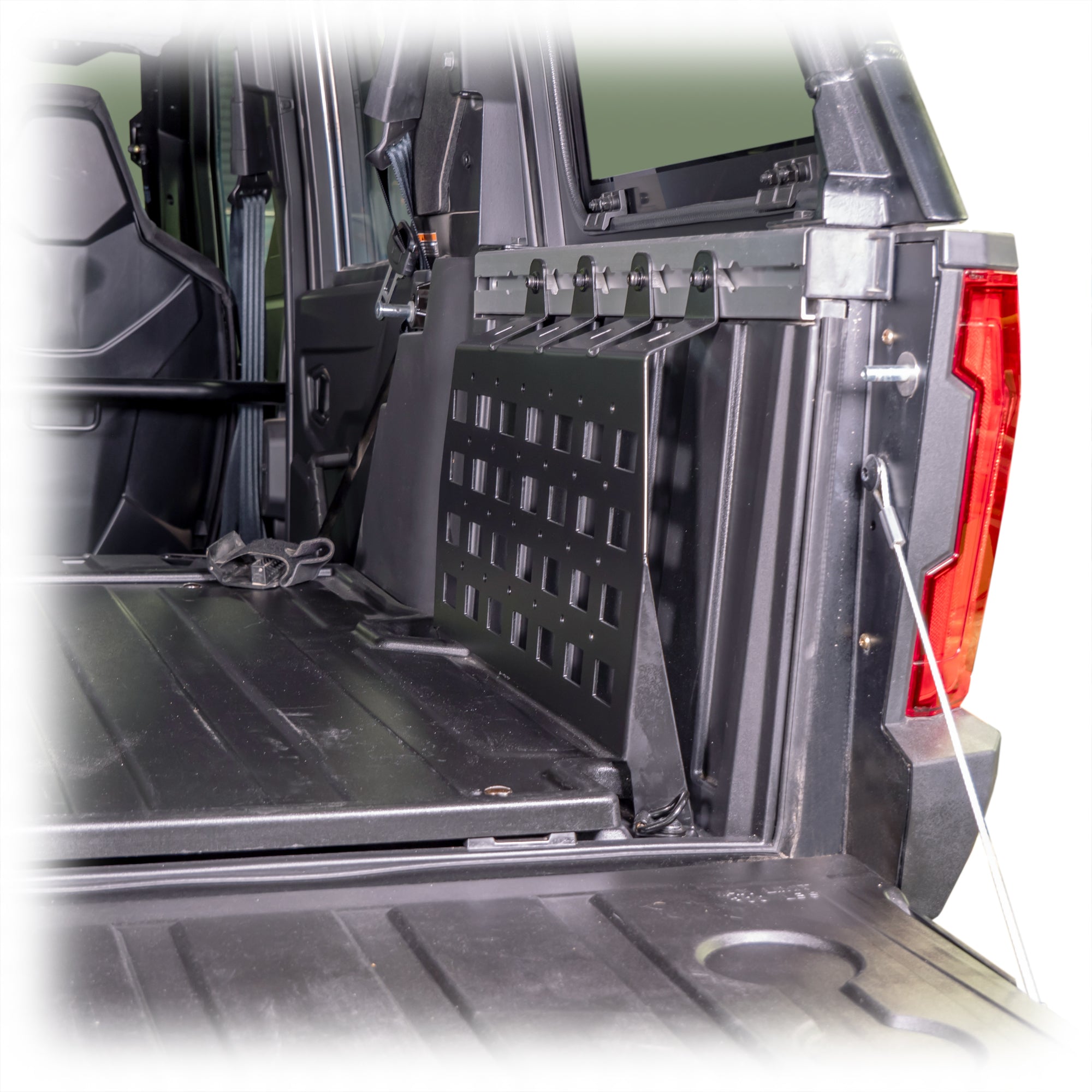 Side panel molle system for securing gear in cargo area
