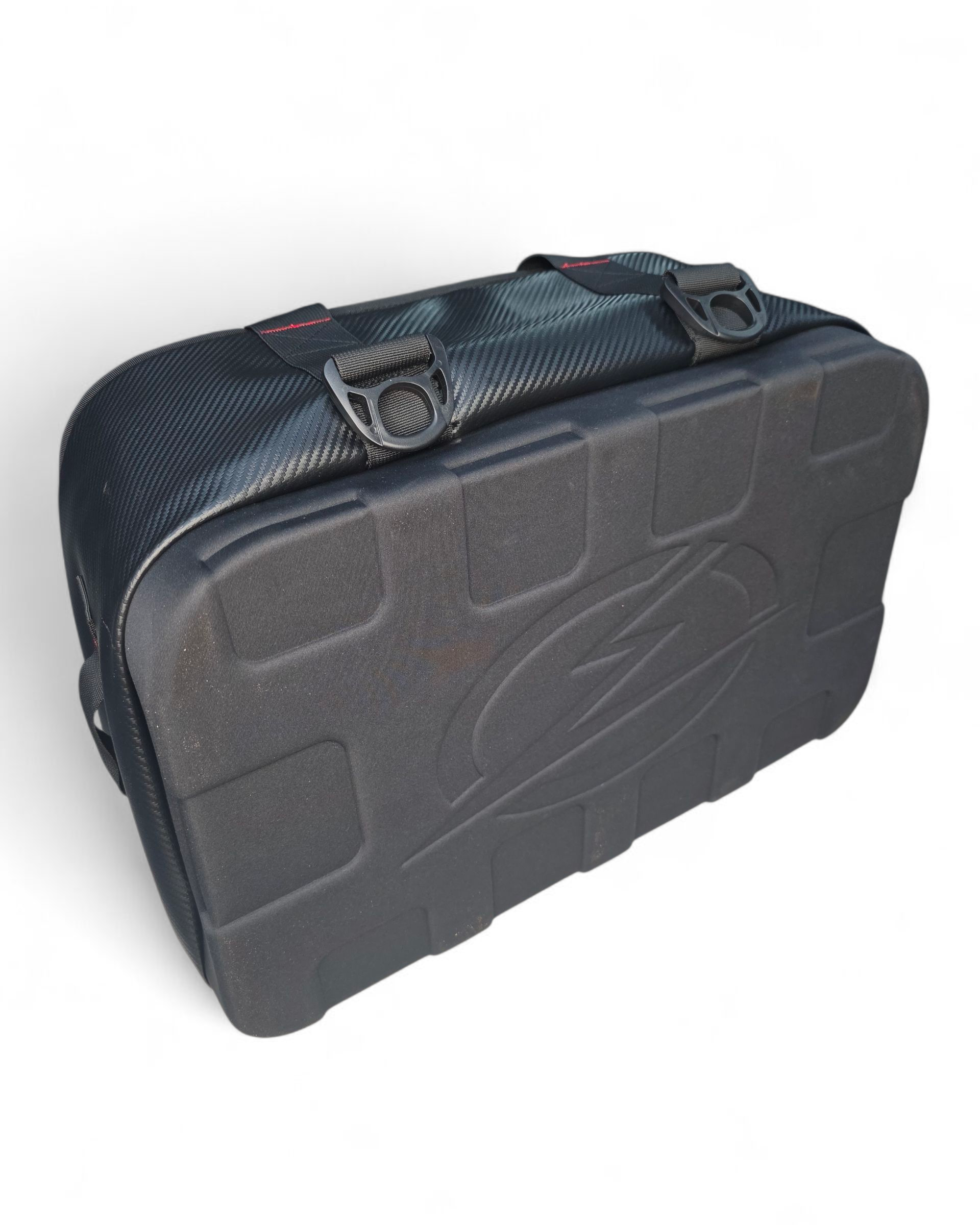 Soft cooler bag strapped into a UTV bed using tie-down points