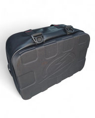Soft cooler bag strapped into a UTV bed using tie-down points
