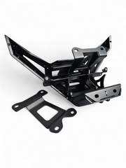 Hidden steel winch mount detail on black anodized Can-Am Maverick X3 billet front bumper showing frame-attached construction
