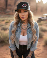 Woman wearing the EOD Two-Tone Trucker Hat outdoors next to a UTV on the trail