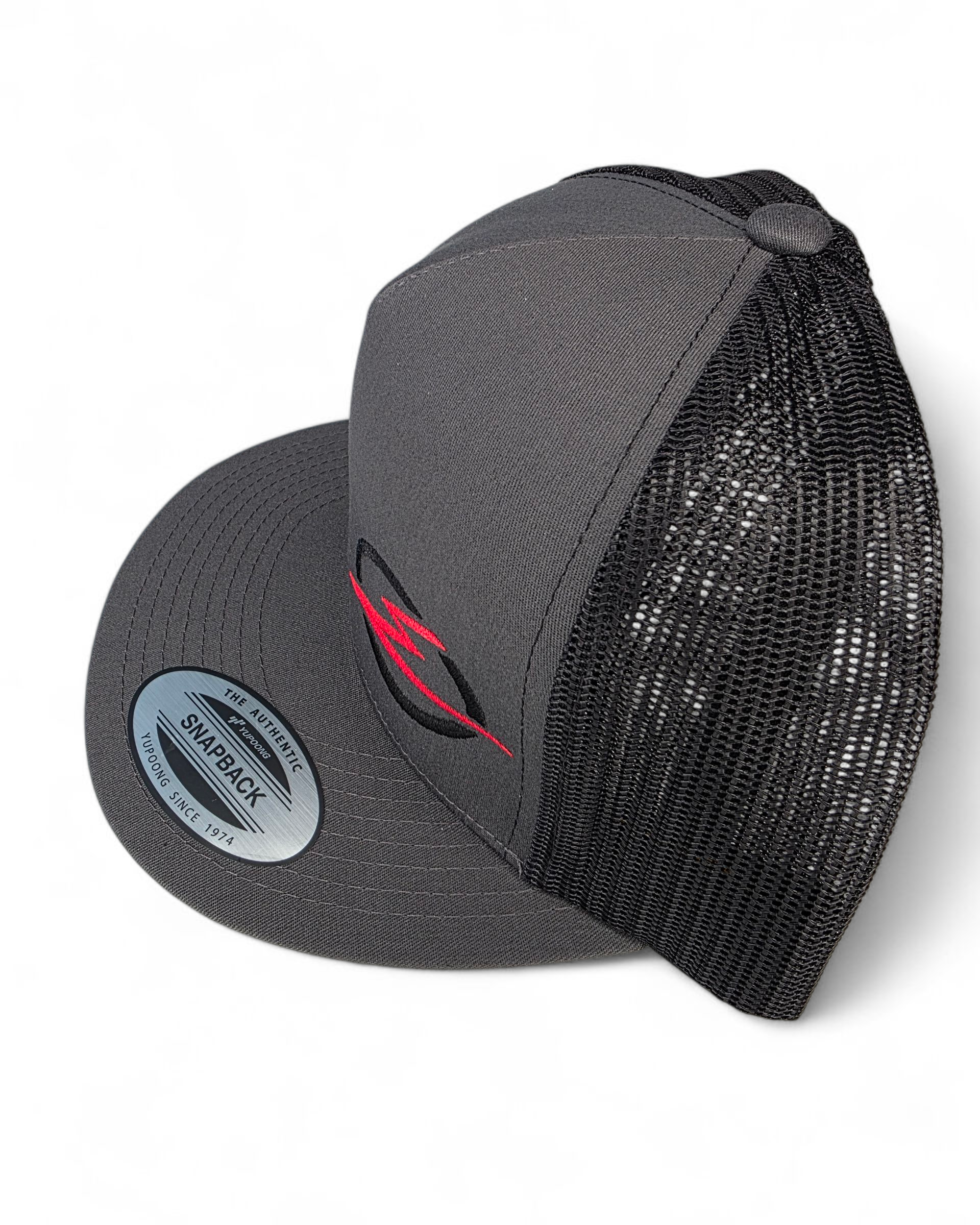 Side profile of EOD charcoal/black two-tone trucker hat