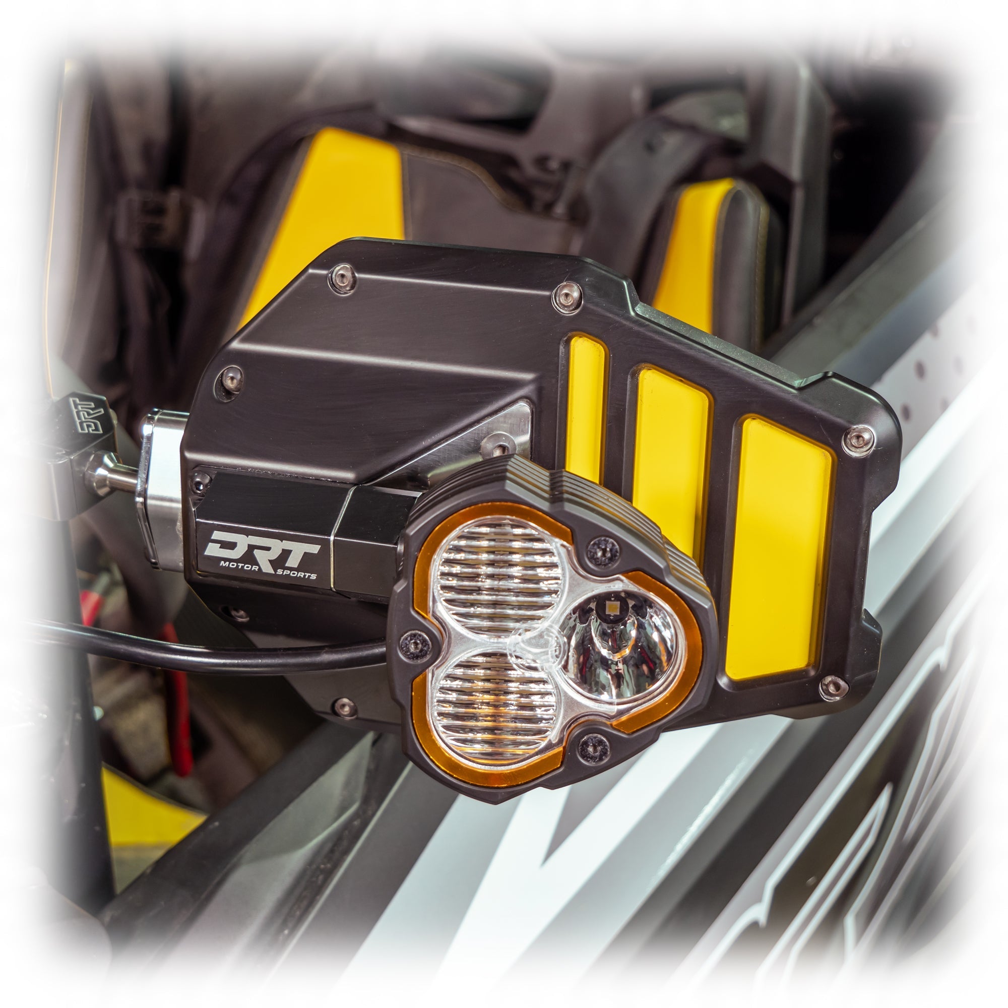 Tactical mirror light bracket kit installed on UTV mirror with light mounted